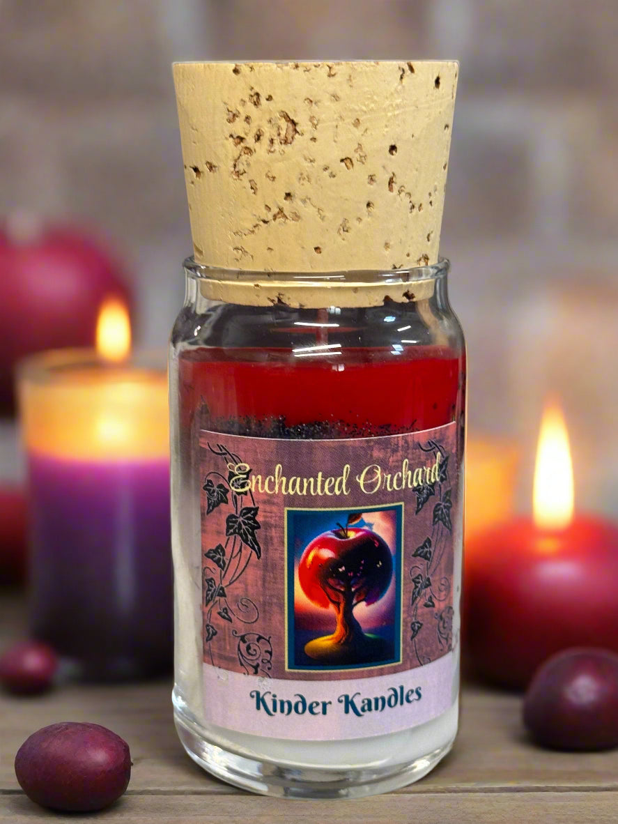 Candle in a glass jar with a label on a textured surface